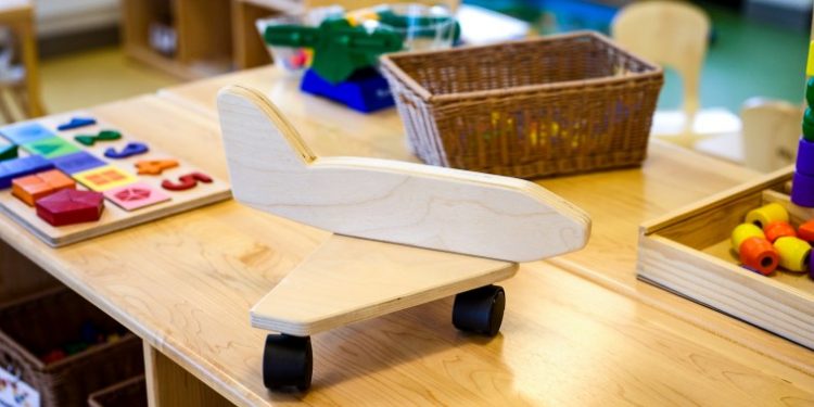 Airports, racing to hire workers, compete to look after their kids