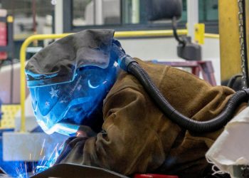 U.S. economic growth for last quarter is revised down to a 2.1% annual rate