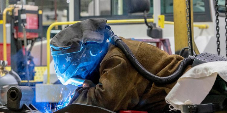 U.S. economic growth for last quarter is revised down to a 2.1% annual rate