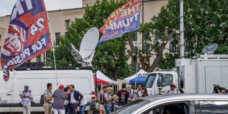 Outside of Trump’s arraignment, revelers mark dueling visions of justice
