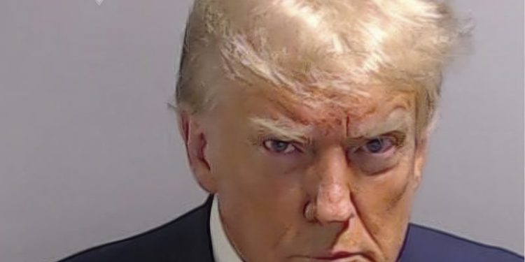 Trump is selling his mug shot on shirts, koozies and bumper stickers