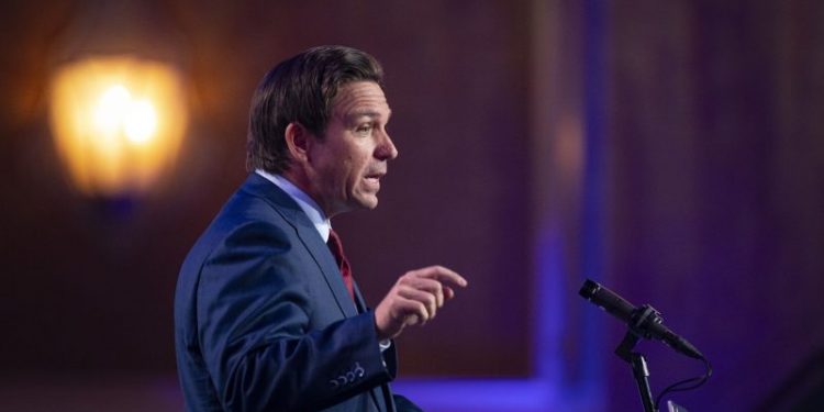 Bashing boosters, DeSantis contrasts with Trump and worries health experts