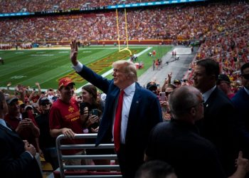 Trump and DeSantis converge again in Iowa at rivalry game, with different styles