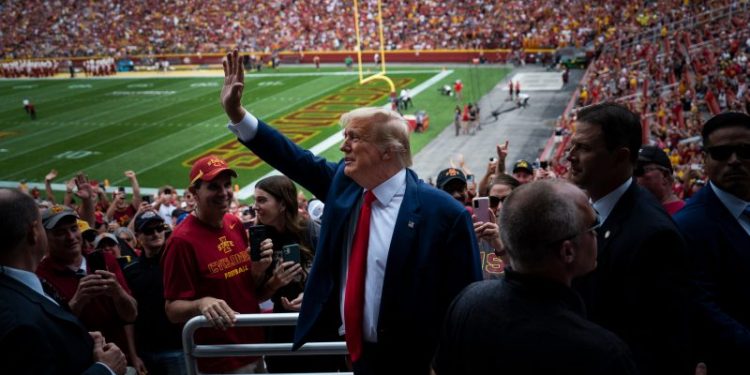 Trump and DeSantis converge again in Iowa at rivalry game, with different styles