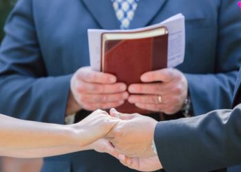 Officiant fires gun to welcome bride, shoots grandson — and wedding goes on