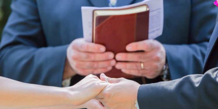 Officiant fires gun to welcome bride, shoots grandson — and wedding goes on