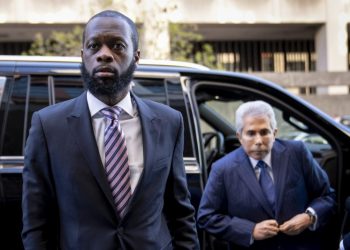 Ex-DOJ employee who testified against Fugees rapper sentenced