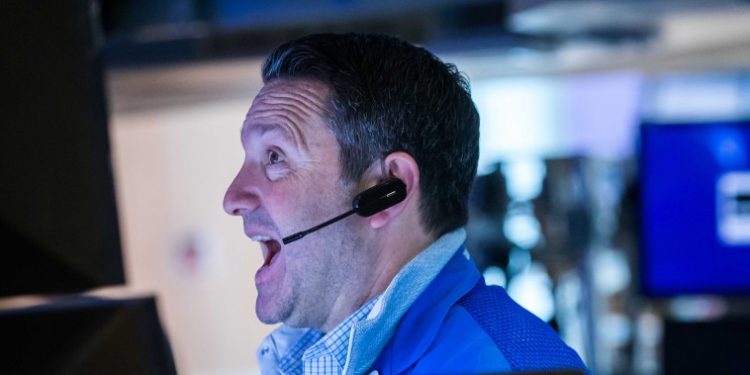 Dow rallies more than 500 points to record, closes above 37,000 for the first time