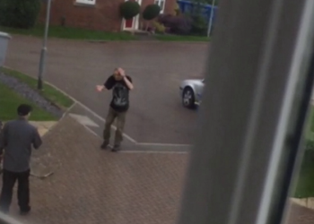 Neighbors caught on camera fighting each other with garden tools in quiet cul-de-sac