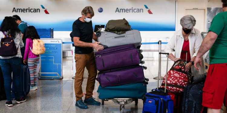 American Airlines raises bag fee by $10 for luggage checked at the airport