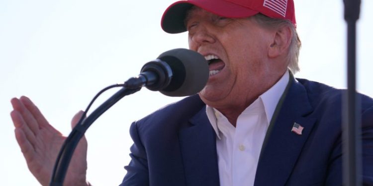 Donald Trump shares image of Joe Biden with hands and feet tied